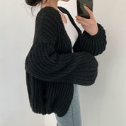 Oversized dames trui – chunky knit trui met ballonmouwen en open design