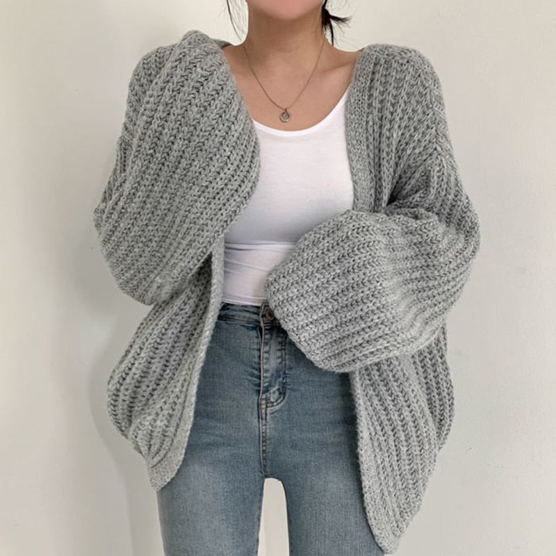 Oversized dames trui – chunky knit trui met ballonmouwen en open design