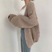 Oversized dames trui – chunky knit trui met ballonmouwen en open design