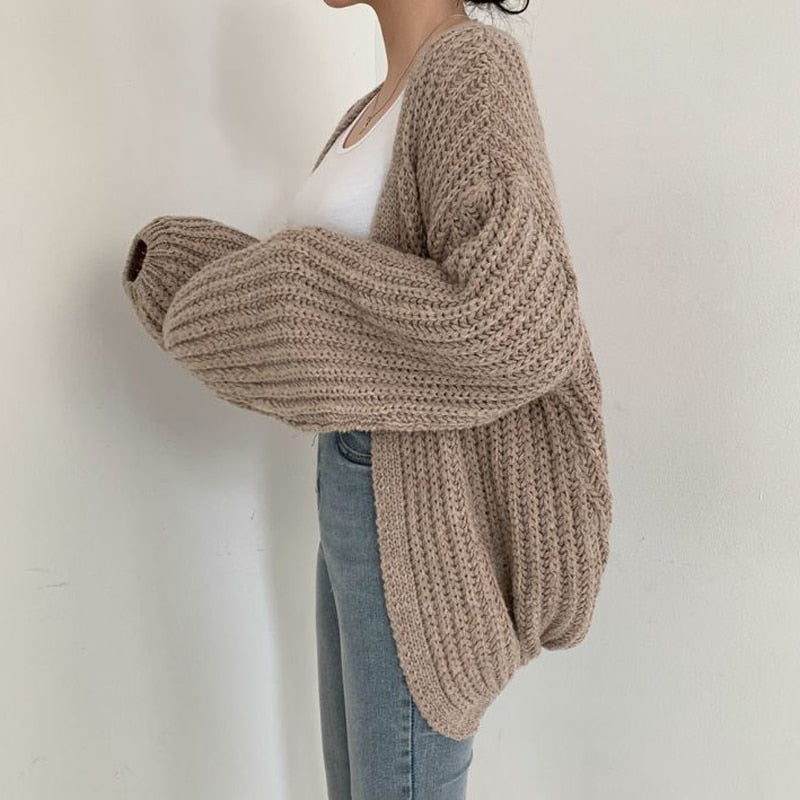 Oversized dames trui – chunky knit trui met ballonmouwen en open design