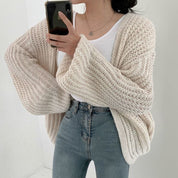 Oversized dames trui – chunky knit trui met ballonmouwen en open design